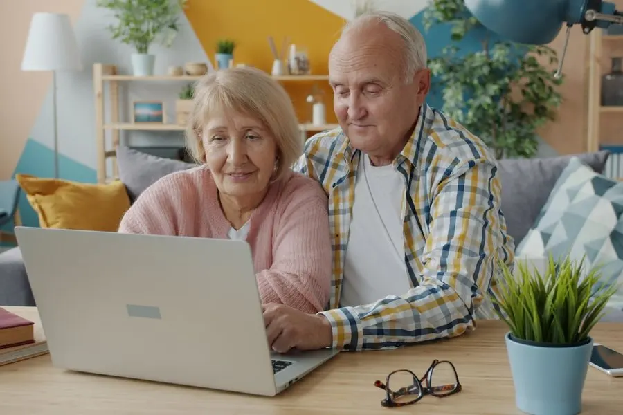 A couple learning together at a laptop