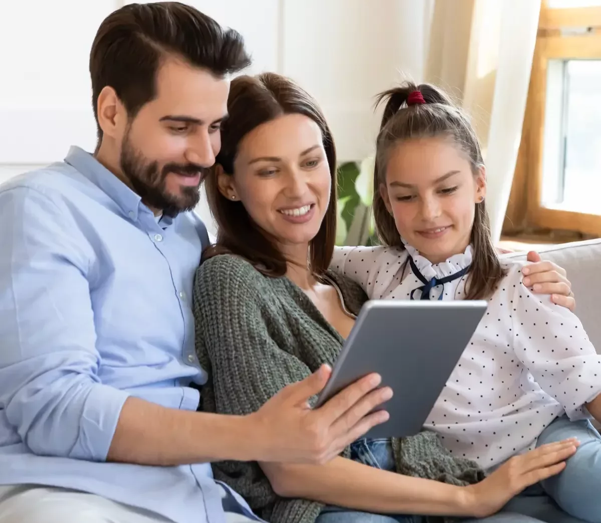 Happy family enjoying their technology after TekStop saved the day.